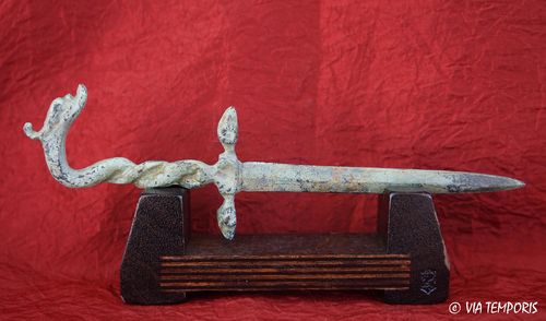 OPEN LETTERS WITH FORM OF ROMAN GLADIUS AND DOLPHIN GREEN PATINA